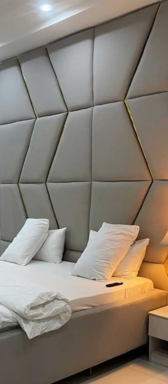 Geometric upholstered bedroom wall